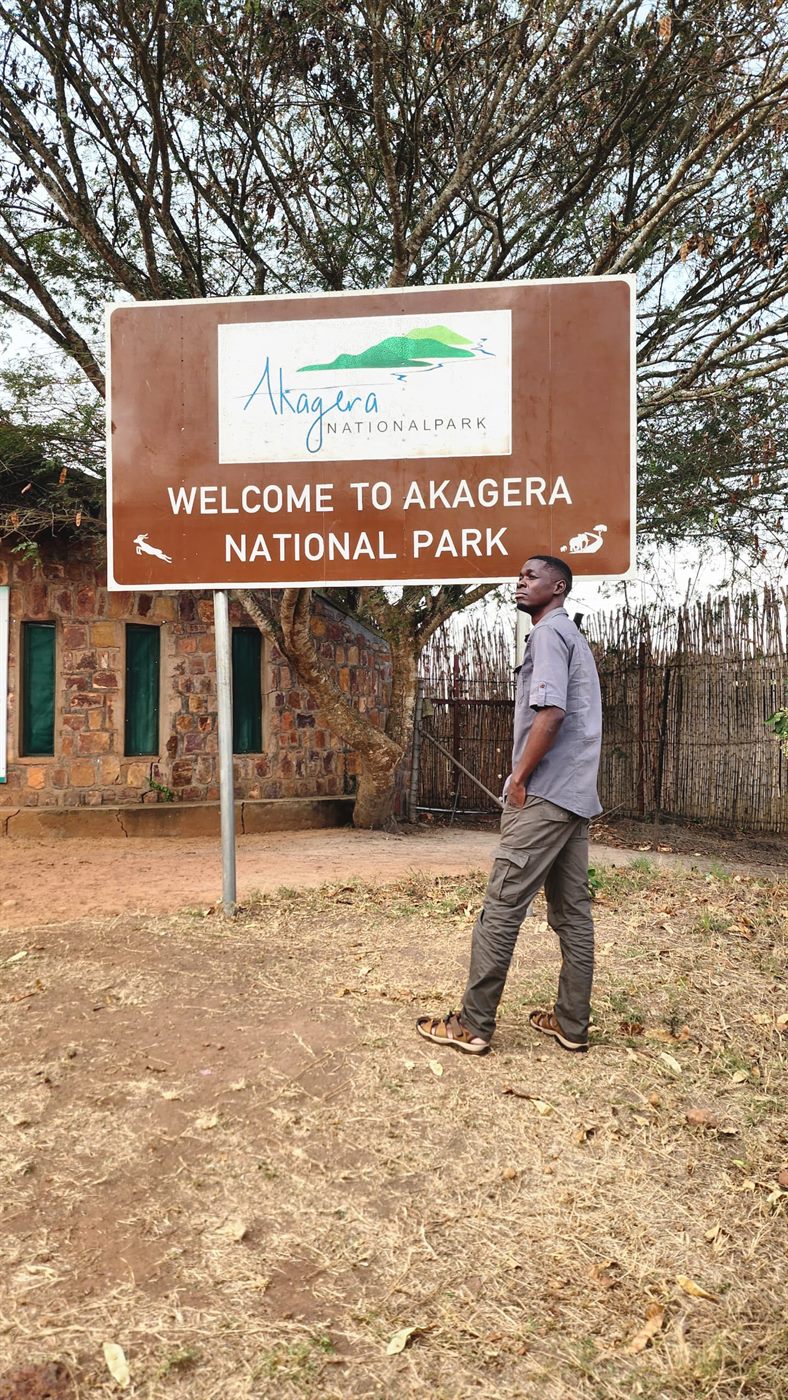 Paius near the Akagera National Park welcome sign