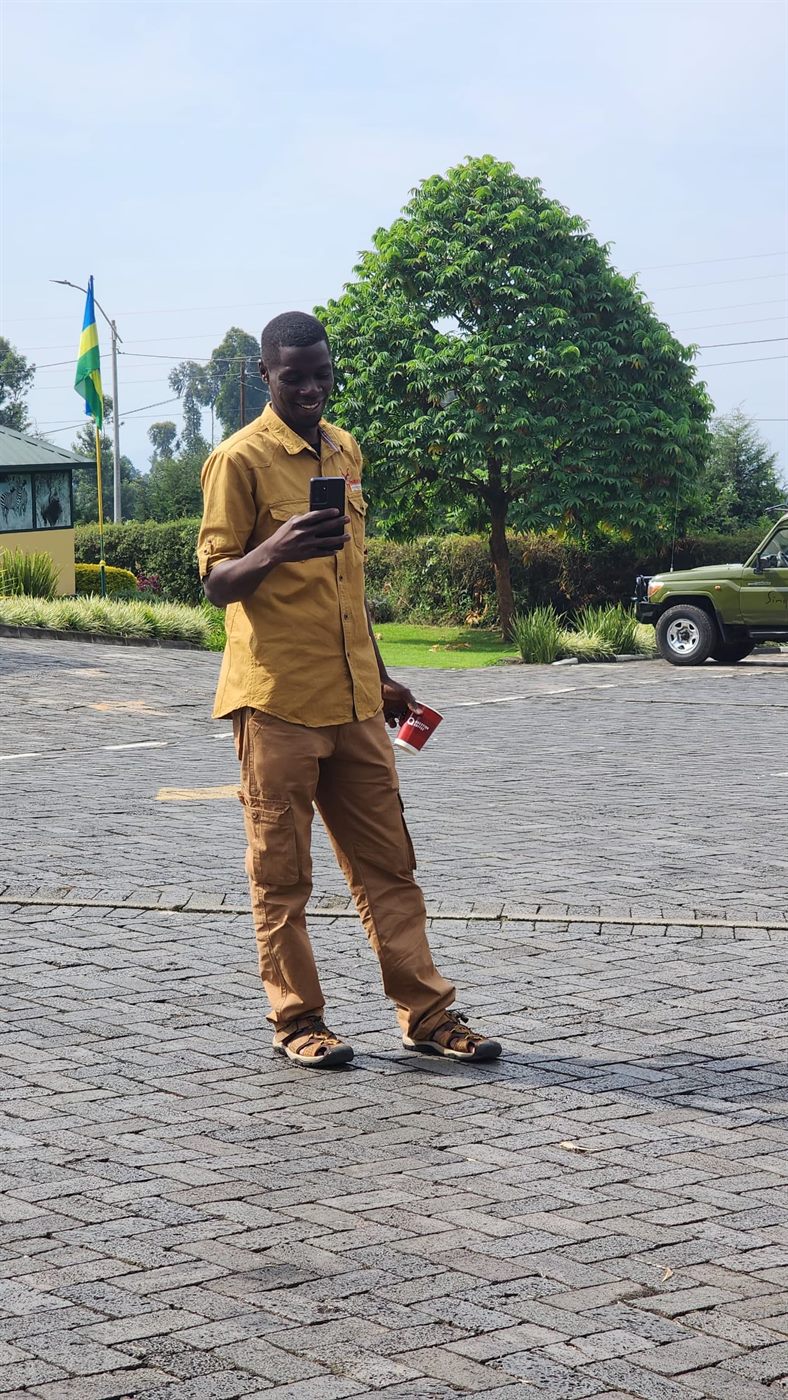 Paius standing outside at a lodge area