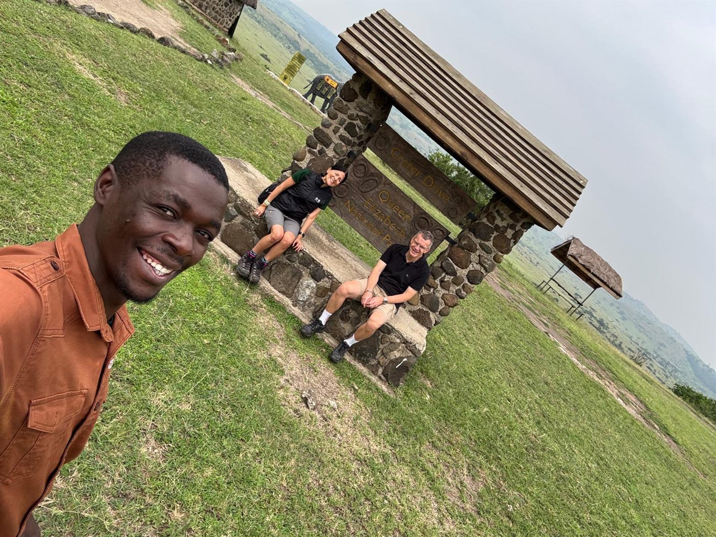 Paius taking a selfie with guests at a scenic stop
