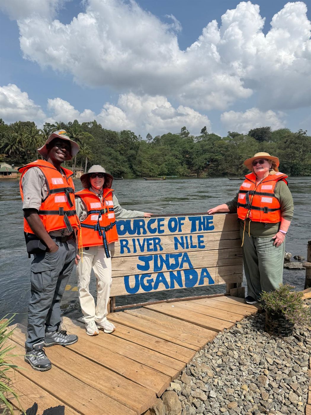 Paius and guests at the Source of the Nile sign